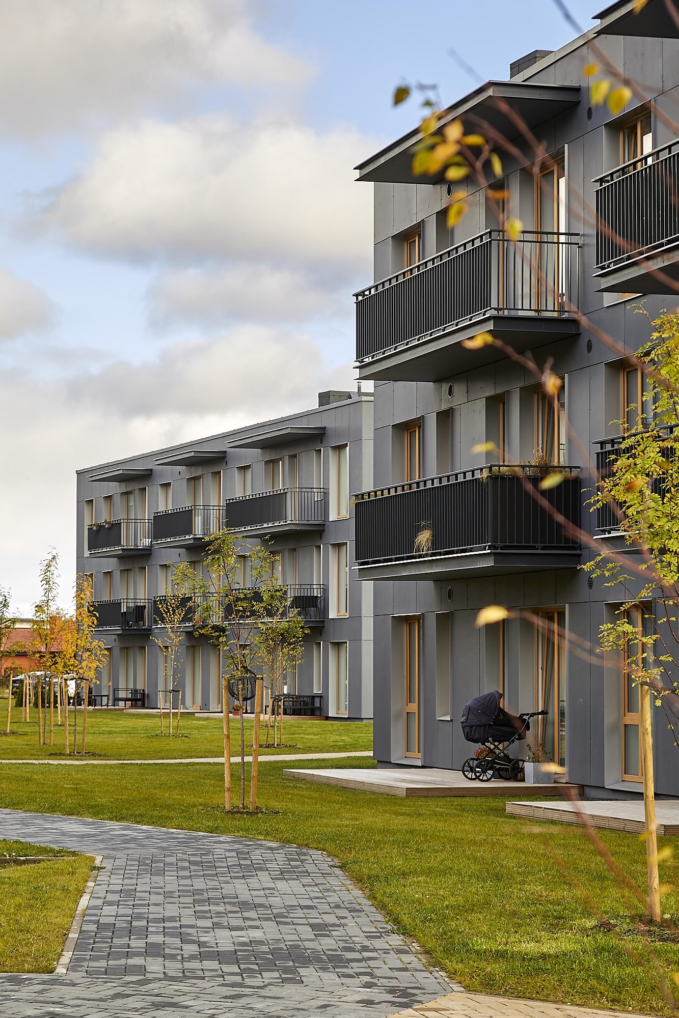 Kesk-Peetri — balconies and paved path in autumn, photo by Triple Net Capital