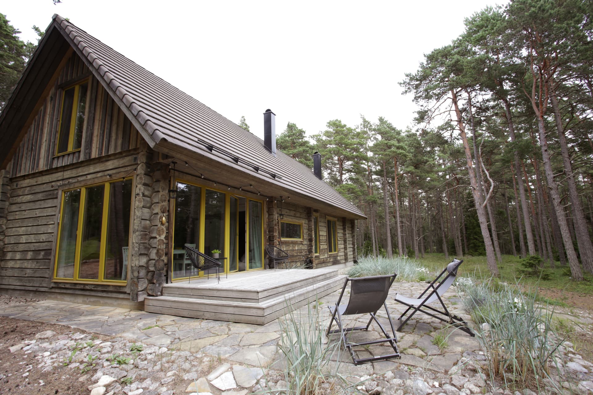 Kalana House log house exterior, pine forest Hiiumaa — ACB