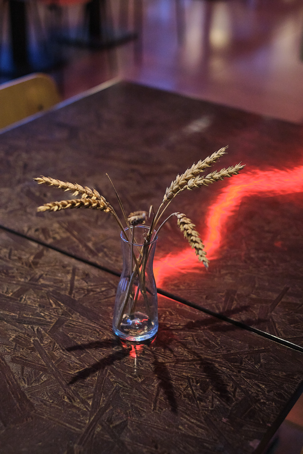 Restaurant Sumi — table detail with wheat in a glass vase, photo by Kevin Loigu