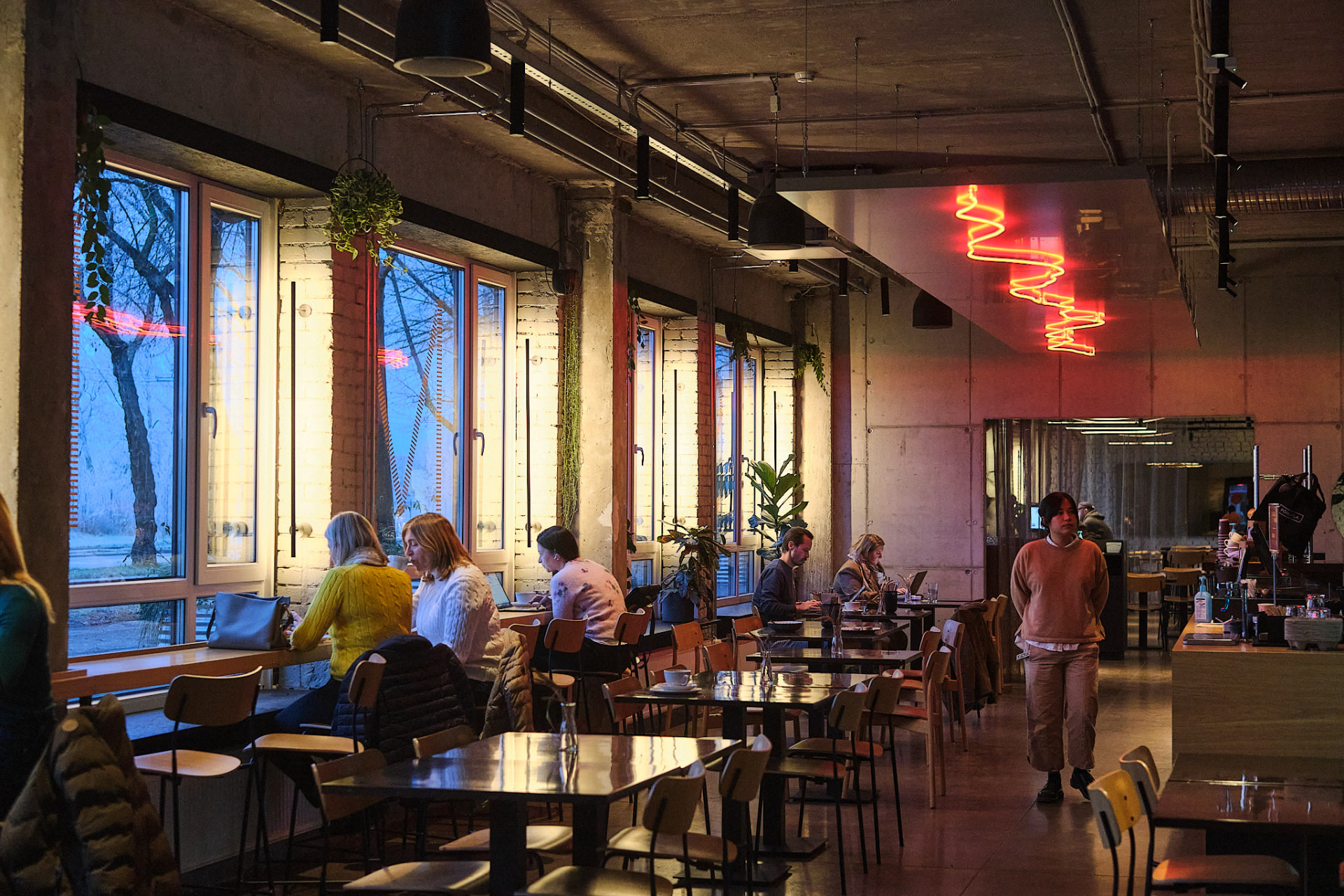 Restaurant Sumi — dining hall by the windows with red neon light, photo by Kevin Loigu